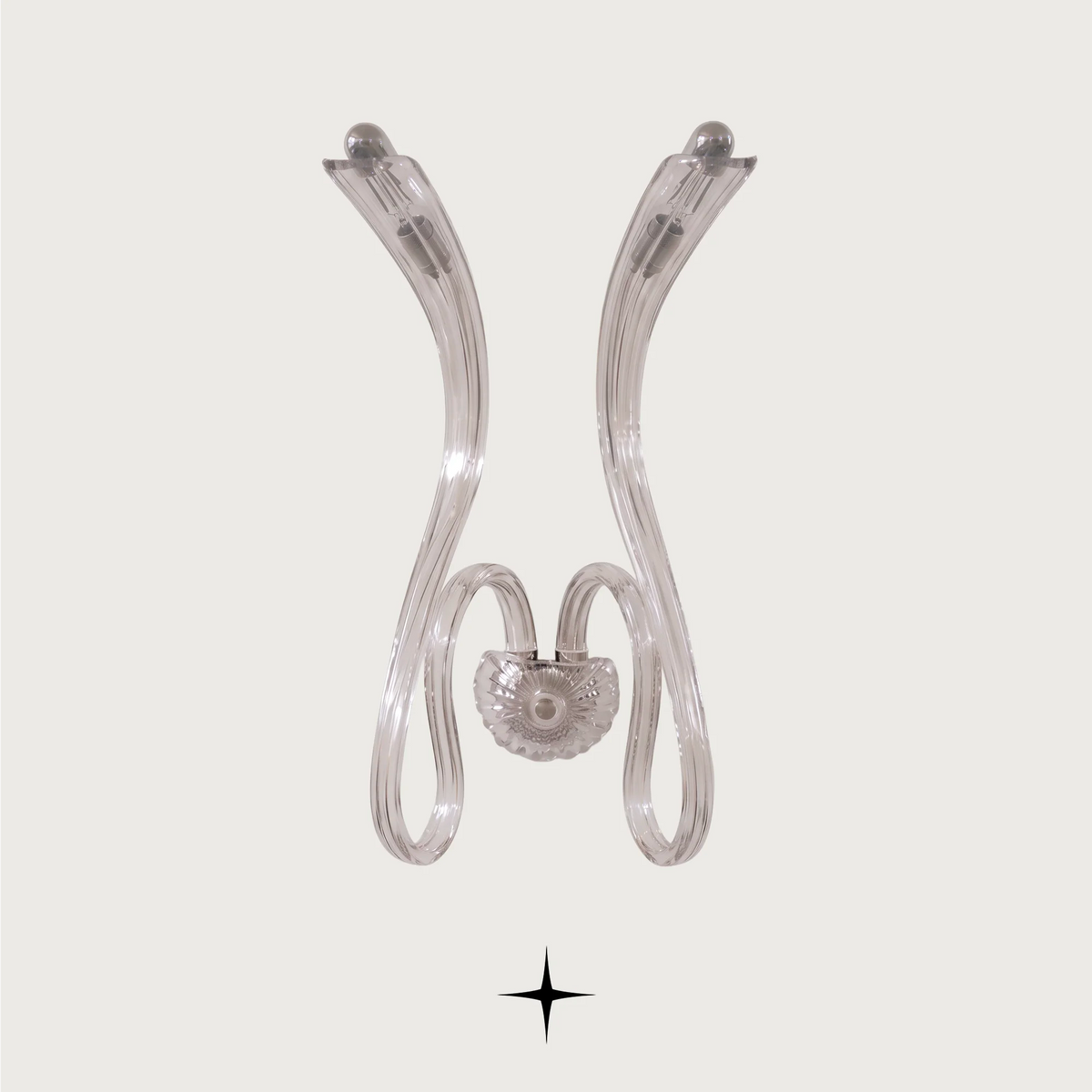 Amara wall light fixture featuring chic elongated crystal arms and modern luxury design.
