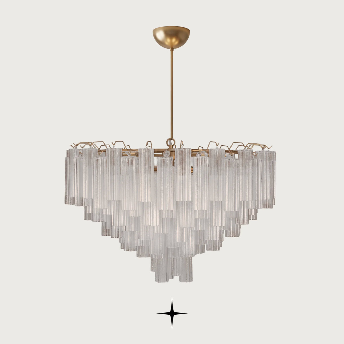 Astra round brass chandelier with cascading fluted ribbed glass tubes on light grey background