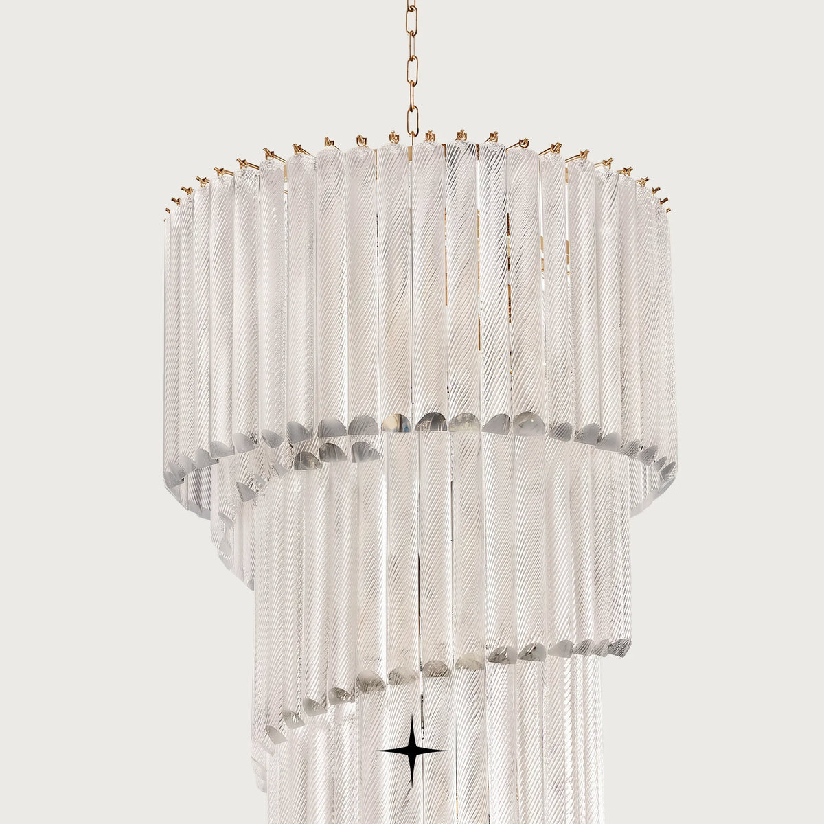 Angled shot of cascading clear glass tiers on the Bride spiral chandelier
