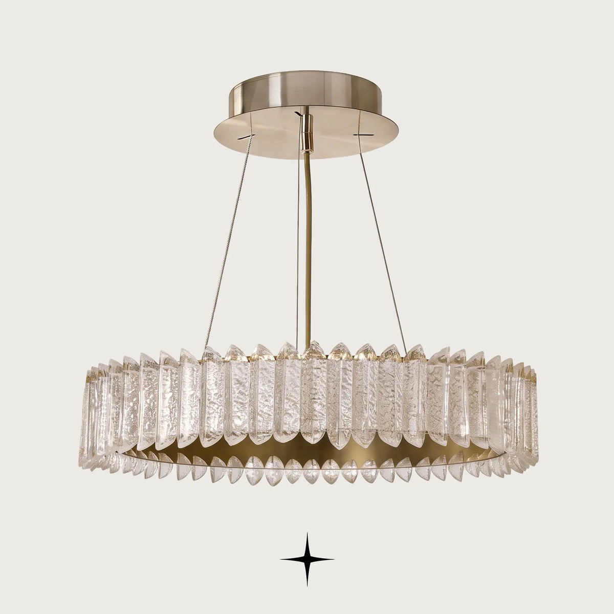 Calgary Chandelier featuring a radiant golden metallic structure and cascading textured crystal prisms in concentric tiers
