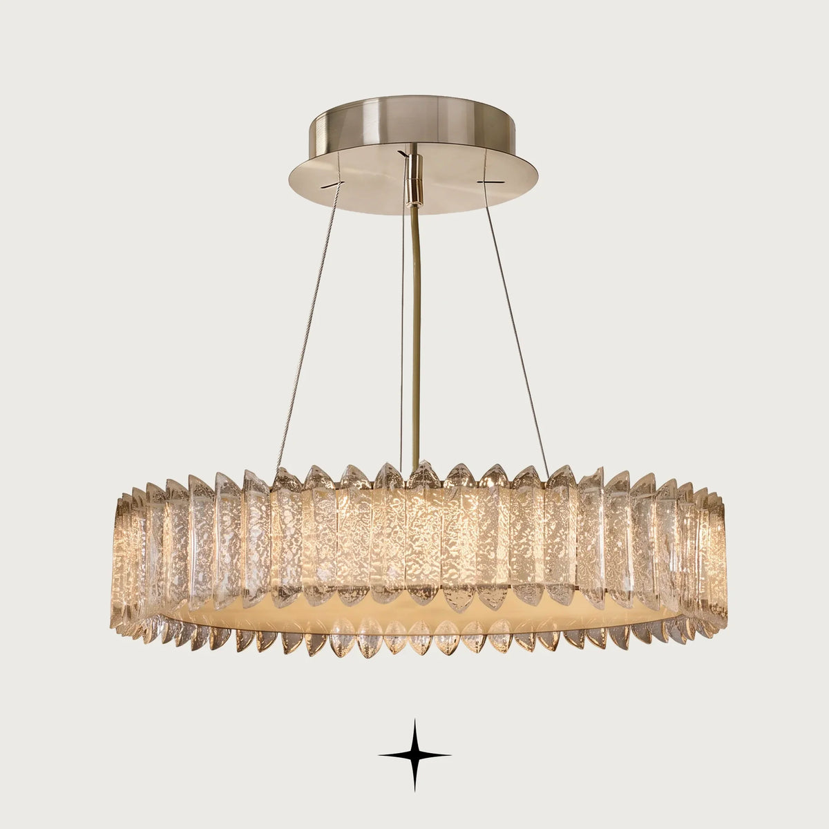 Calgary Chandelier featuring a radiant golden metallic structure and cascading textured crystal prisms in concentric tiers
