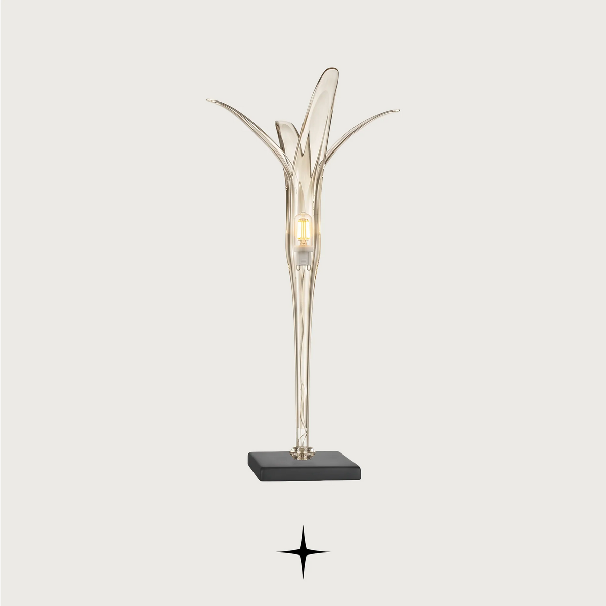 Calorina modern luxury table light with sleek dark teal and gold silhouette for sophisticated living spaces.
