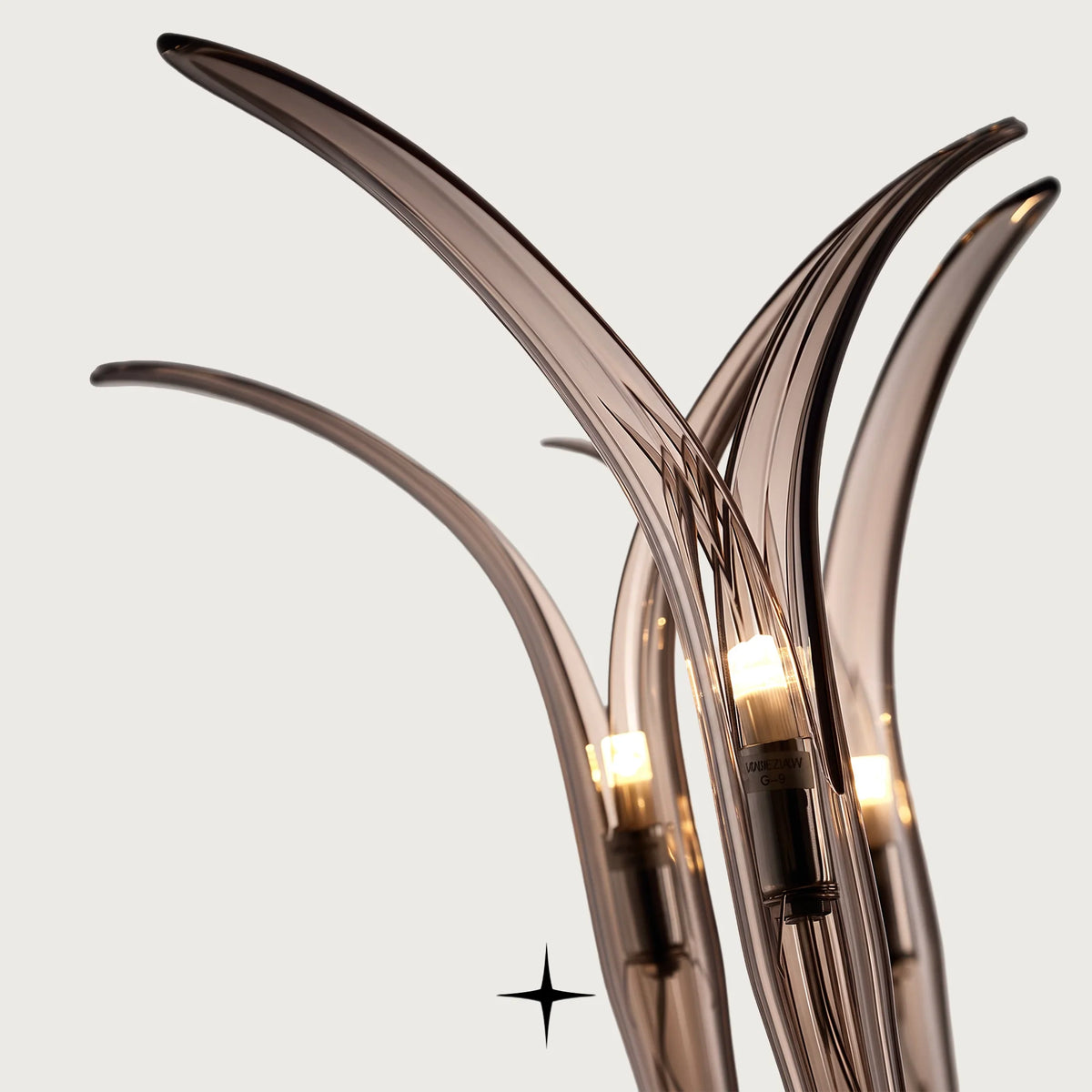 Celine Chandelier featuring elegant smoked grey handcrafted crystal glass arms blooming gracefully upwards

