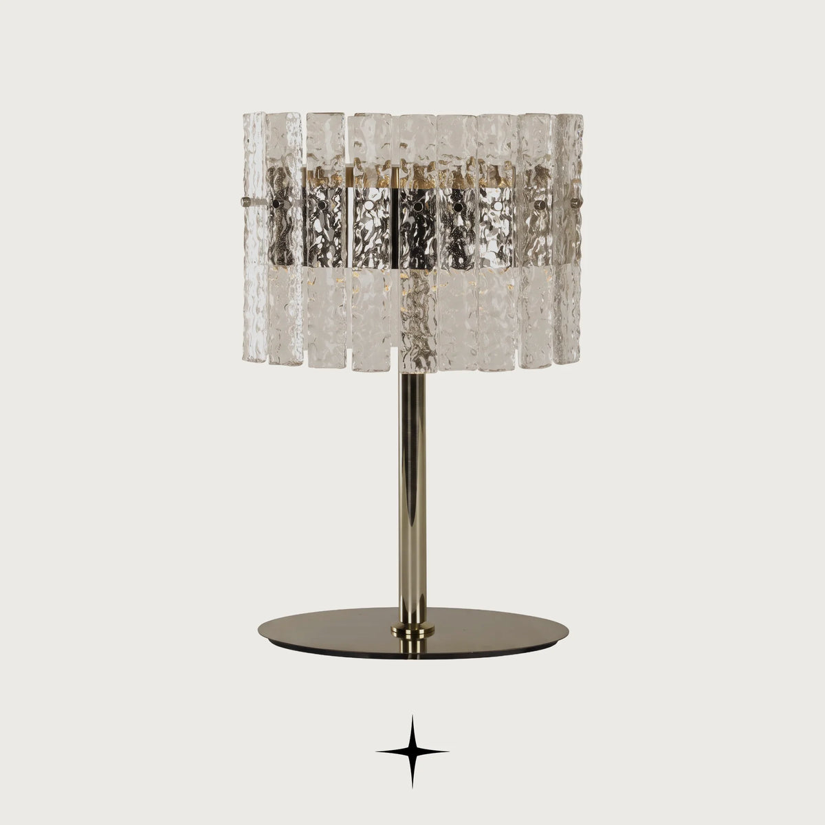 Chime rock crystal effect glass LED table lamp with golden nickel base on a light grey background