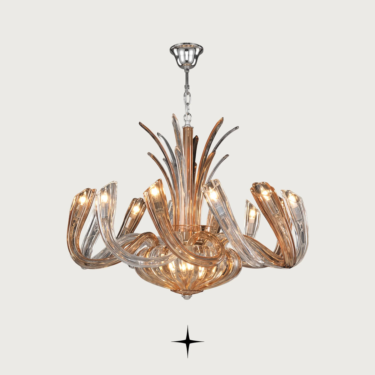 Clara Chandelier featuring chic elongated crystal arms with gold and silver ring options across four sizes
