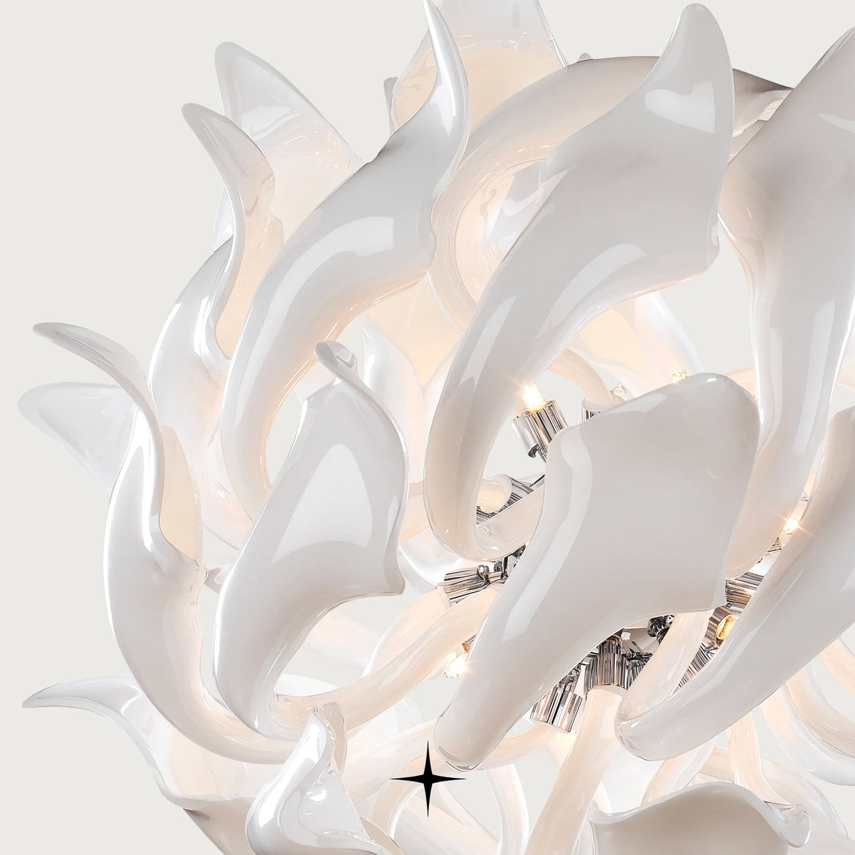 Daria Chandelier featuring 29 arms and 20 G9 LEDs with elegant elongated white crystal elements
