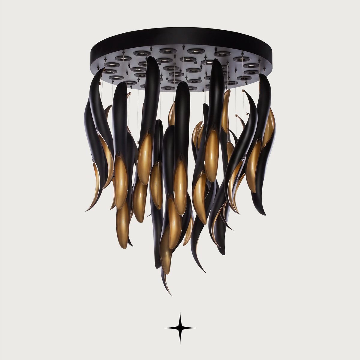 Darken Chandelier featuring a striking contrast of a dripping matte black layer over radiant golden crystals.
