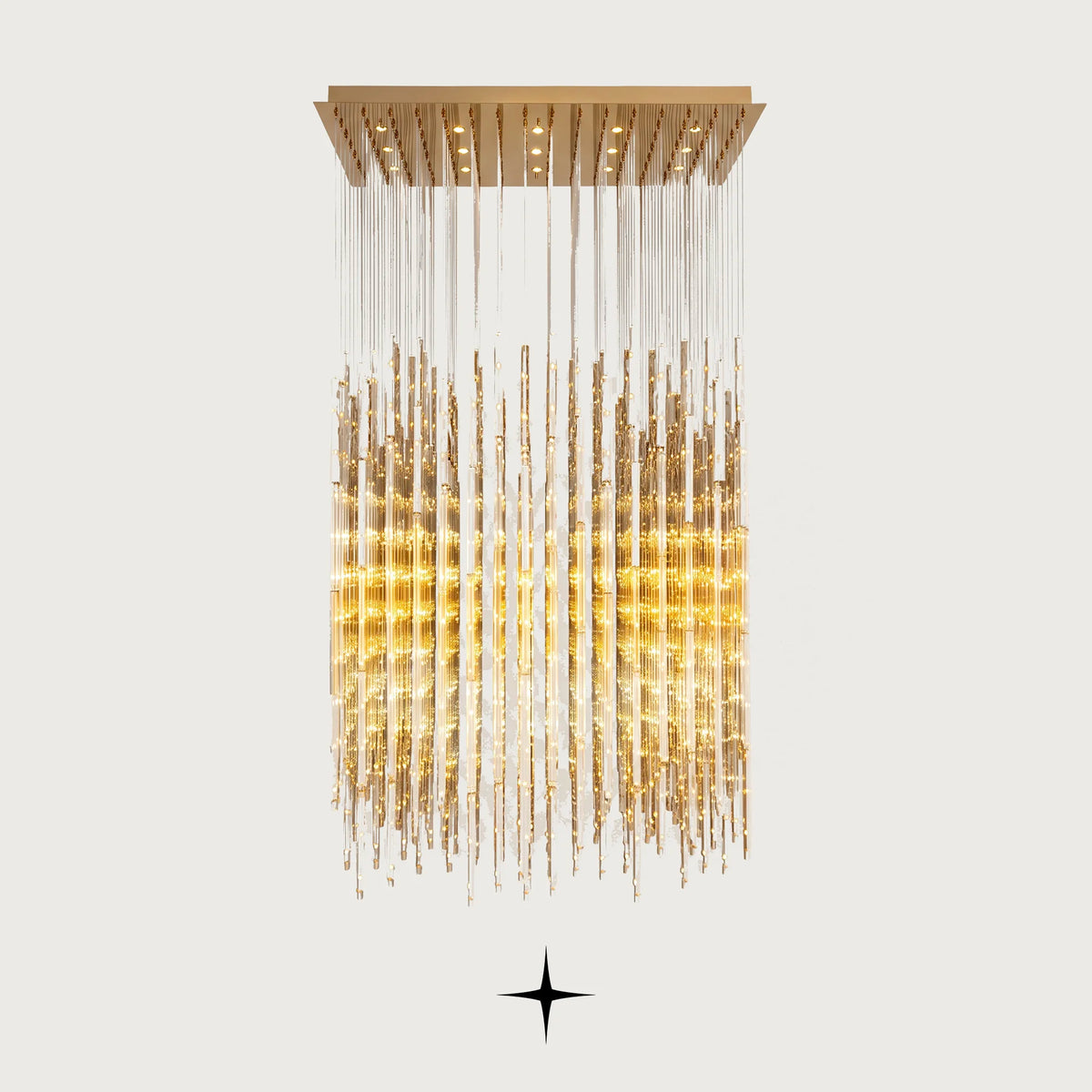 Front view of Echo brass rectangular waterfall chandelier on light grey backdrop