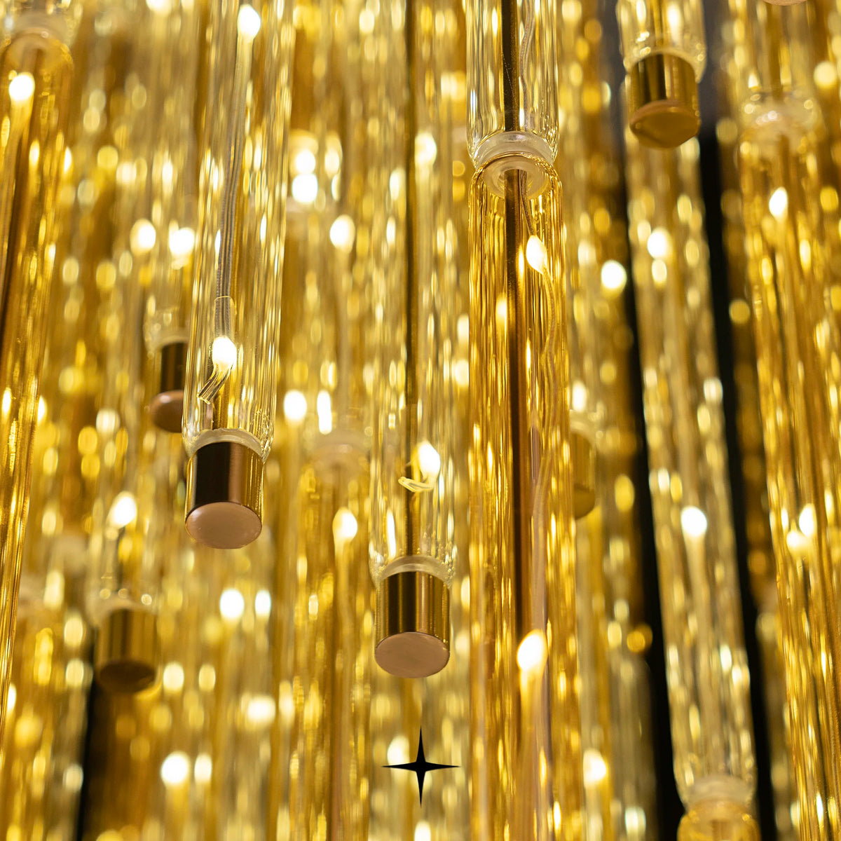 Close-up detail of shimmering golden glass strands on Echo chandelier