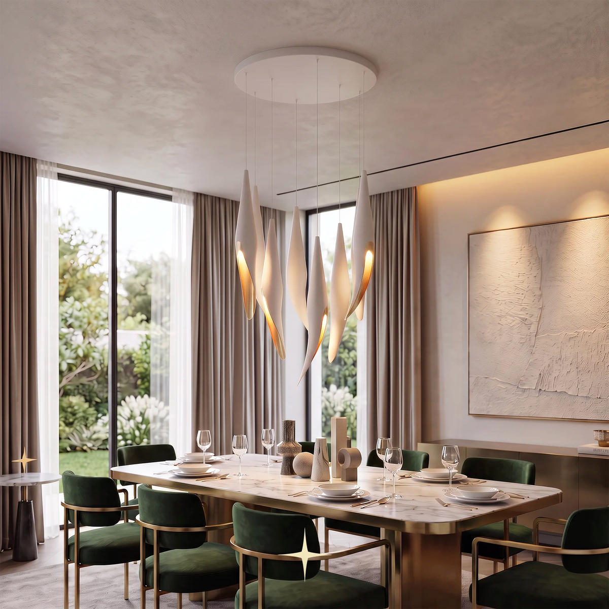 A modern dining room featuring a distinctive Close-up detail of handcrafted crystal components and gold frame on Elegant Bella modern chandelier with white teardrop-shaped glass shades that glow with warm light. The room is furnished with a marble dining table and green velvet chairs with gold frames, set against a backdrop of beige curtains, large windows, and a textured wall art piece.