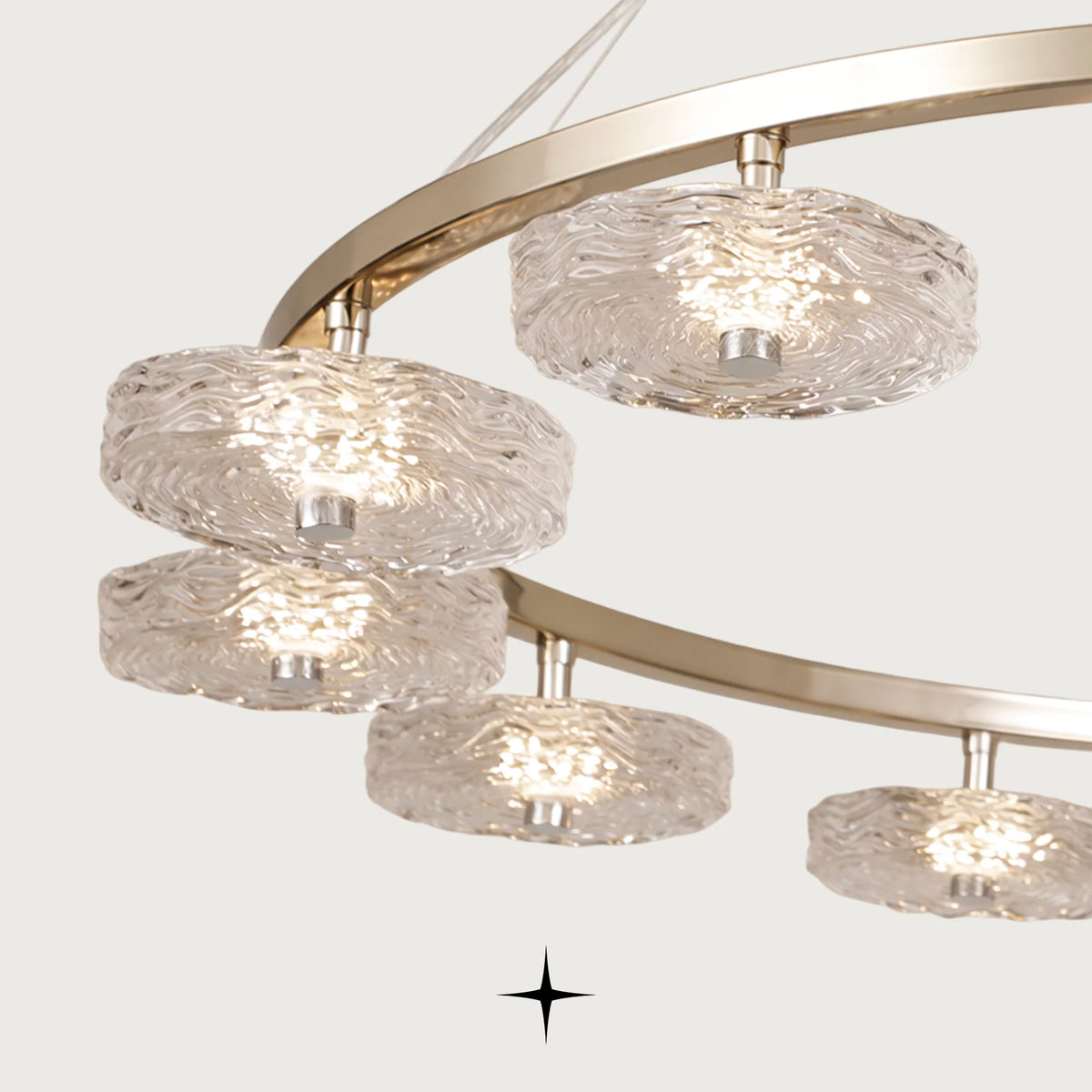 Close up detail of handcrafted Murano glass discs and golden nickel ring on Elegant Charlotte chandelier