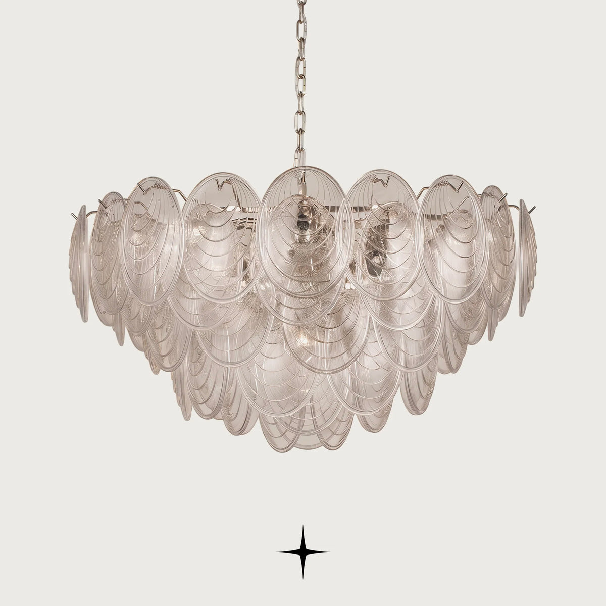 Elegant Moxie oval glass chandelier with golden nickel chain on clean background