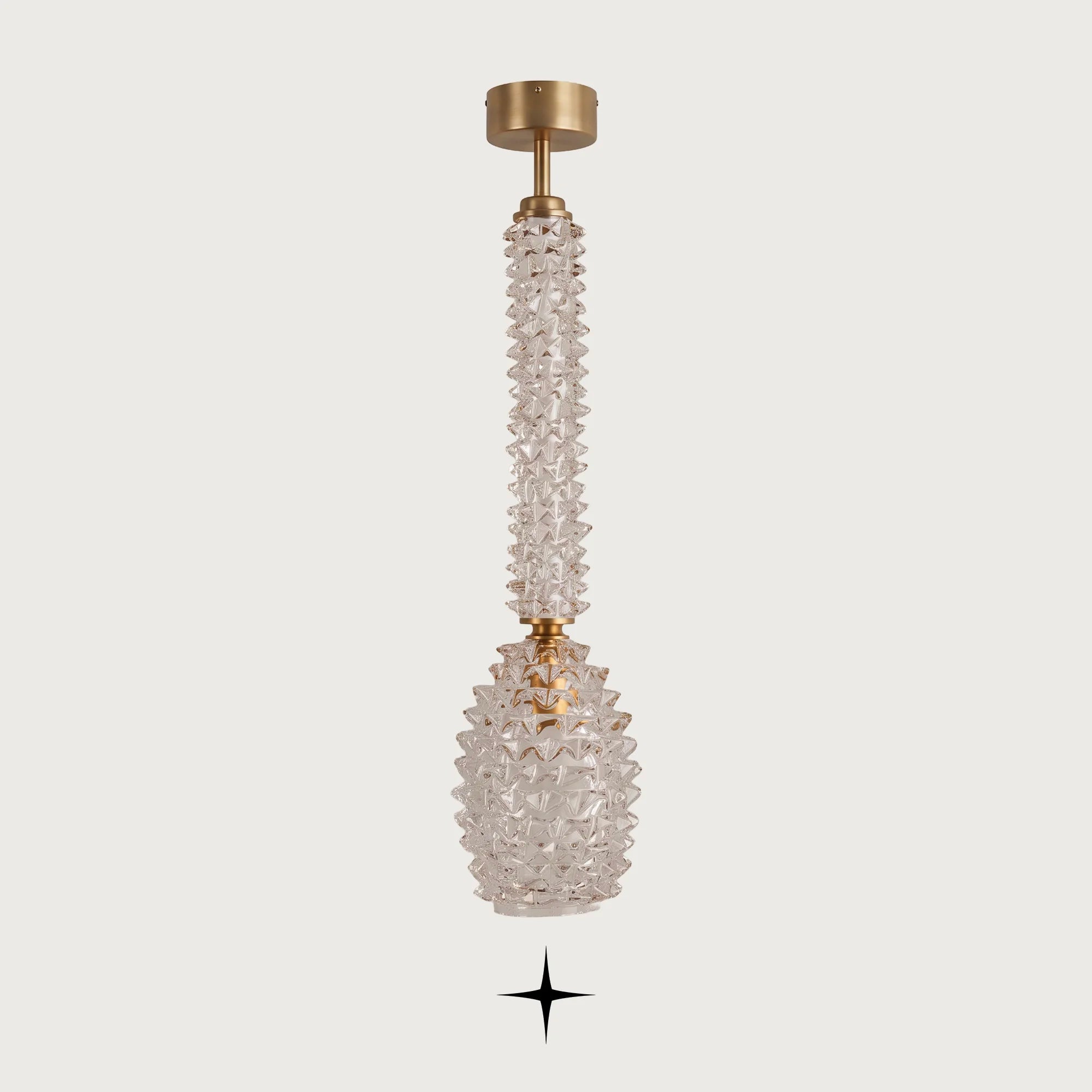 Front view of Elegant Sahara gold and clear glass column chandelier on light grey backdrop