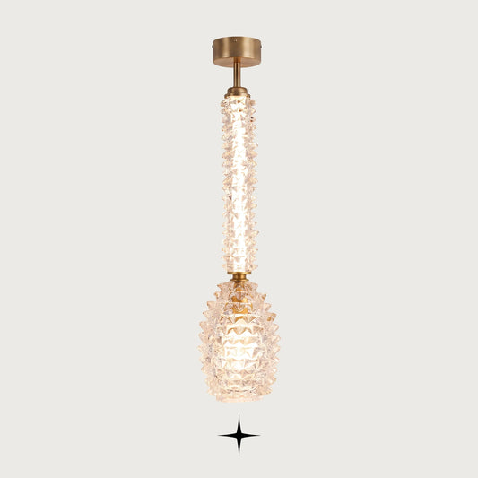 Elegant Sahara clear Murano glass vertical pendant light with golden stem on light grey background