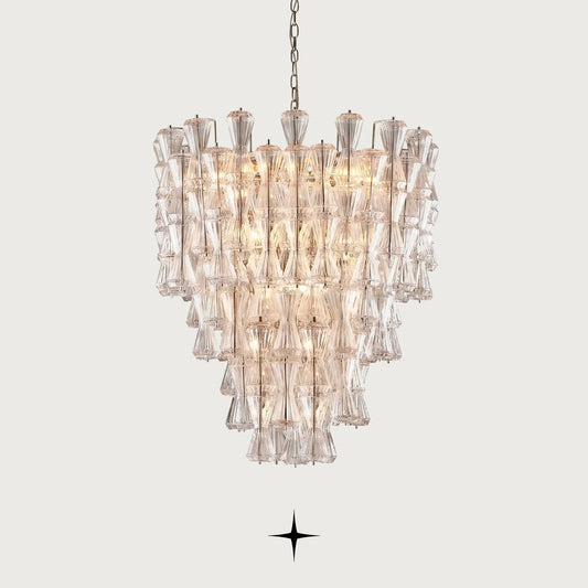 Elegant Seattle multi-tiered Rigadin glass hourglass chandelier illuminated on light grey background
