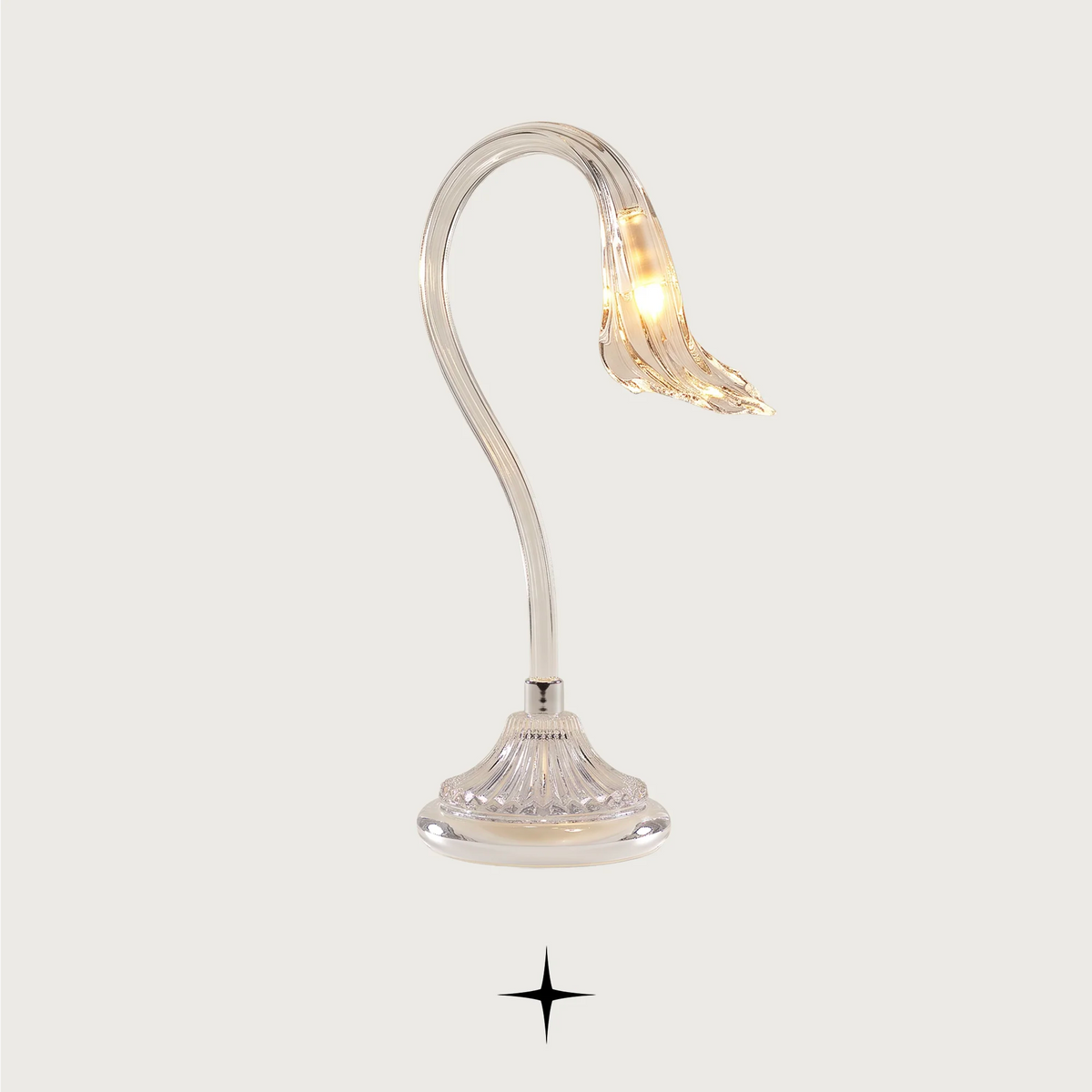 Flare modern luxury table light with sleek silver silhouette for sophisticated living spaces.
