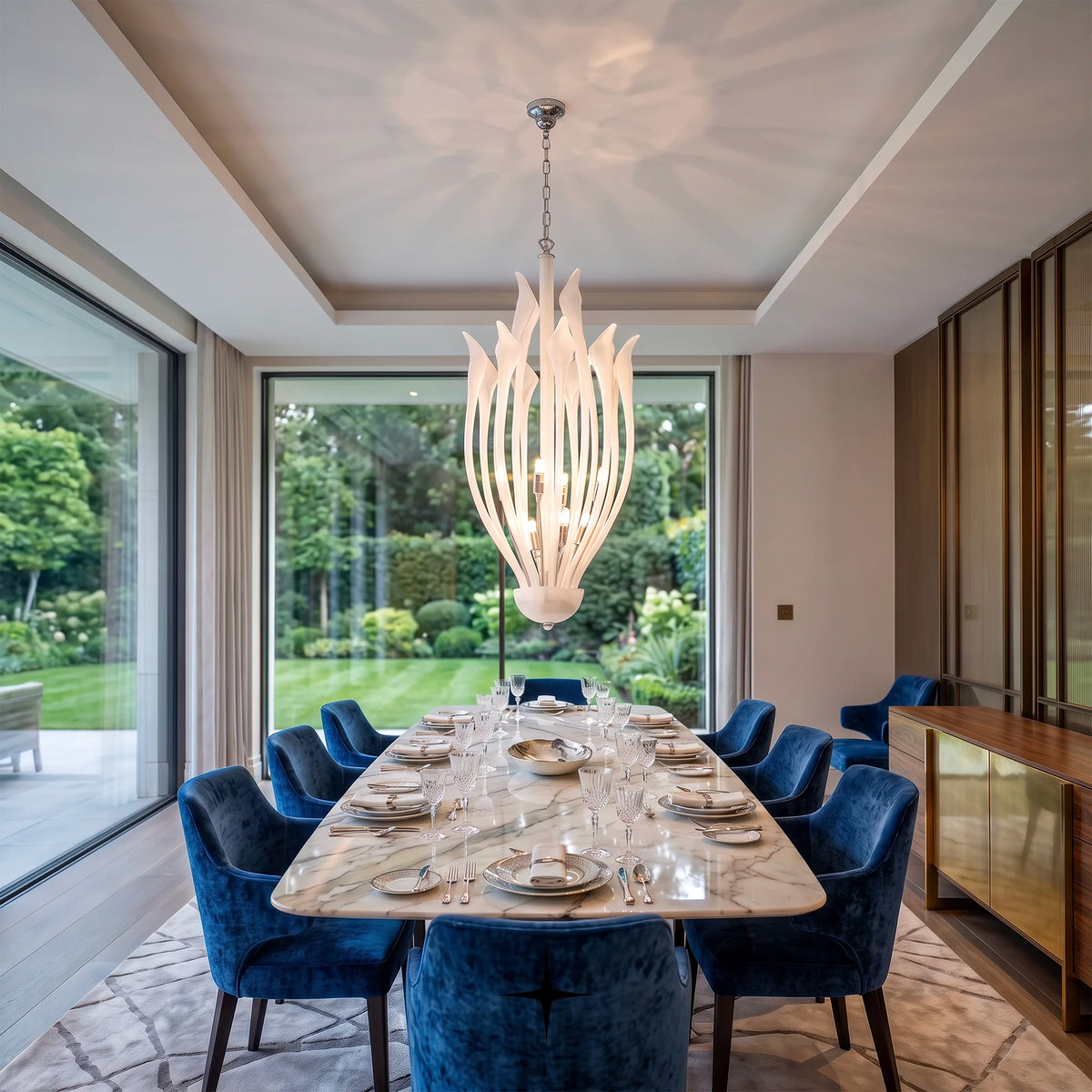 Flora Chandelier featuring flower-inspired white crystals with 10+4 arms and 8 G9 LEDs

