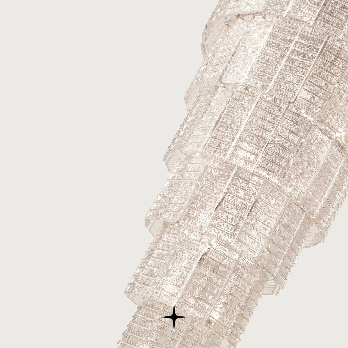 Angled shot of cascading clear glass brick tiers on Grand Angel chandelier
