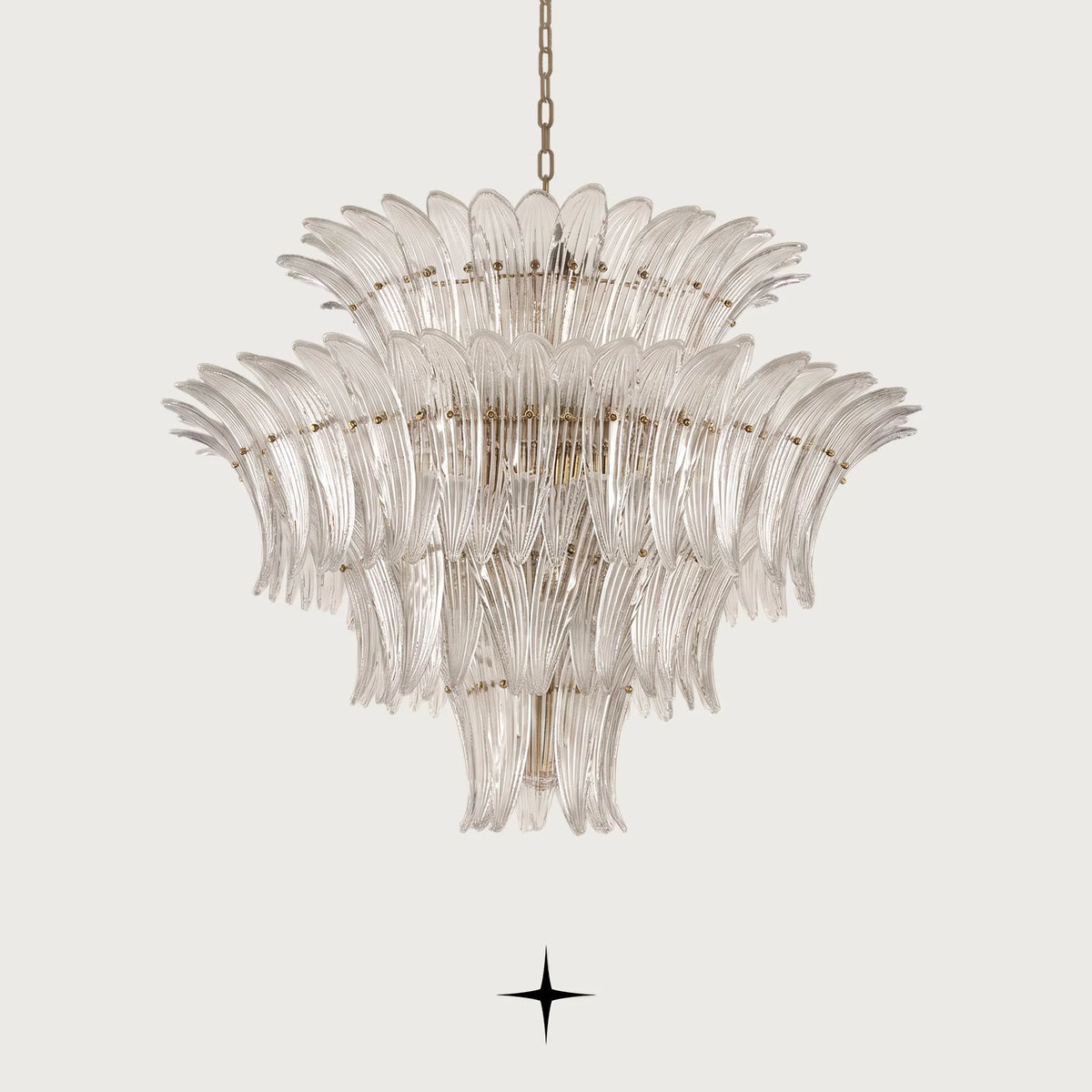 Grand Crown tiered Murano glass leaf chandelier with gold frame illuminated on black background