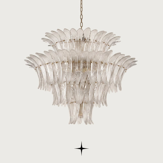 Grand Crown tiered Murano glass leaf chandelier with gold frame illuminated on black background