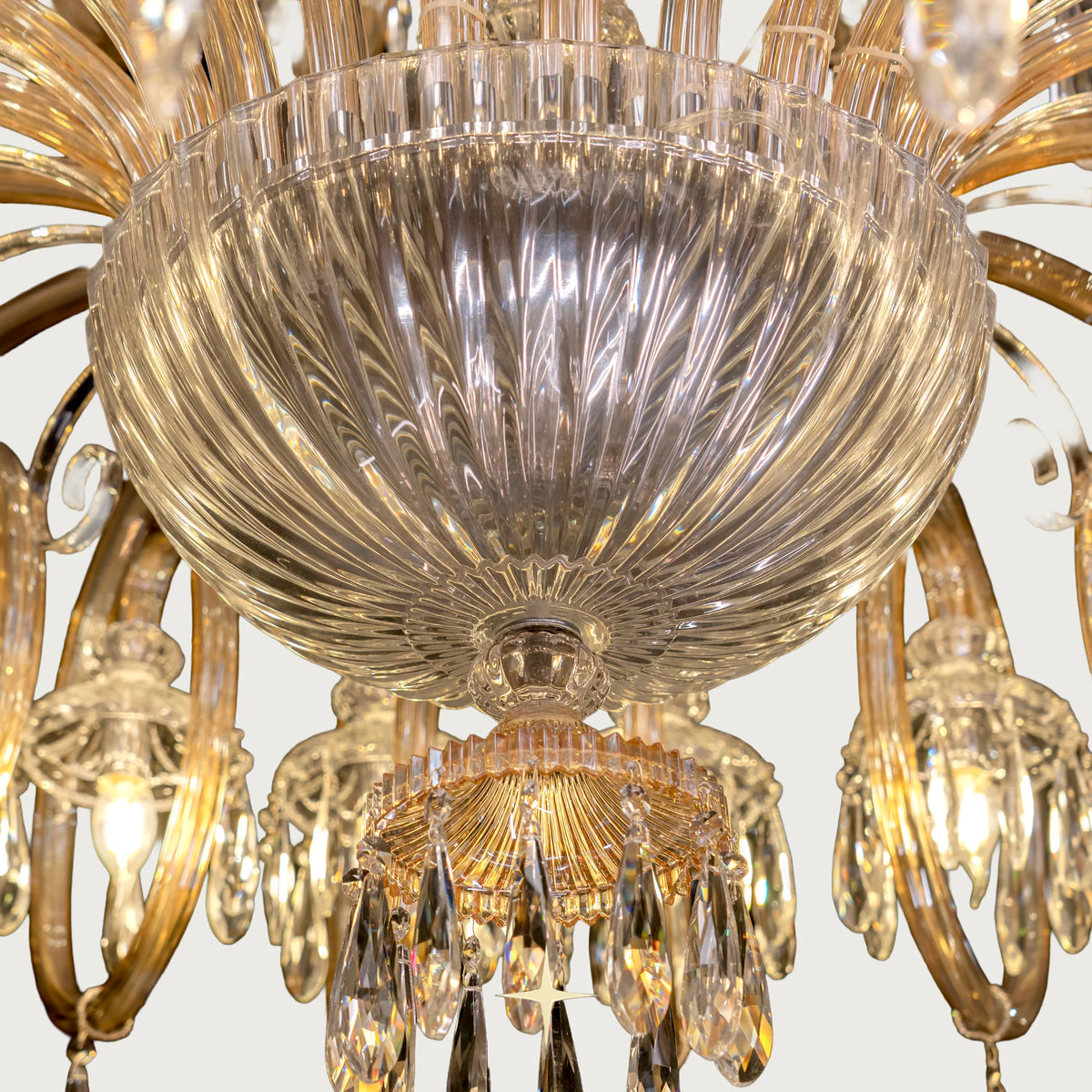 Bottom angle view showing ribbed glass globes and gold rings on Grand Elegance chandelier