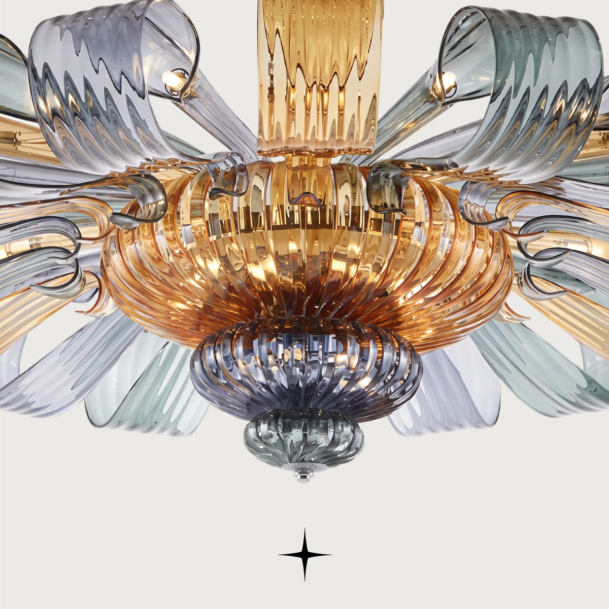 Grand Georgina Chandelier featuring symmetrical crystal artistry and sophisticated matte white and mixed hue options.
