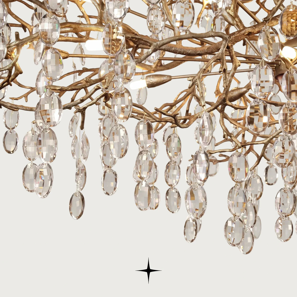 Close-up detail of cascading faceted crystal droplets on Grand Gloria gilded branches