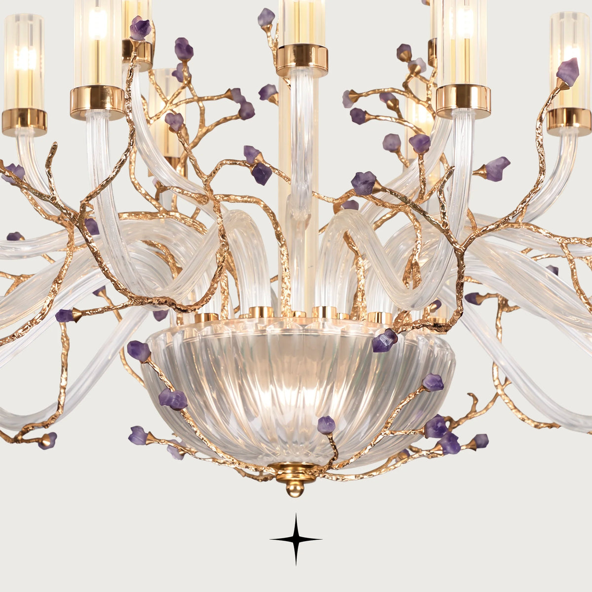 Close-up of sculpted brass branches and natural purple rock elements on Grand Madison chandelier