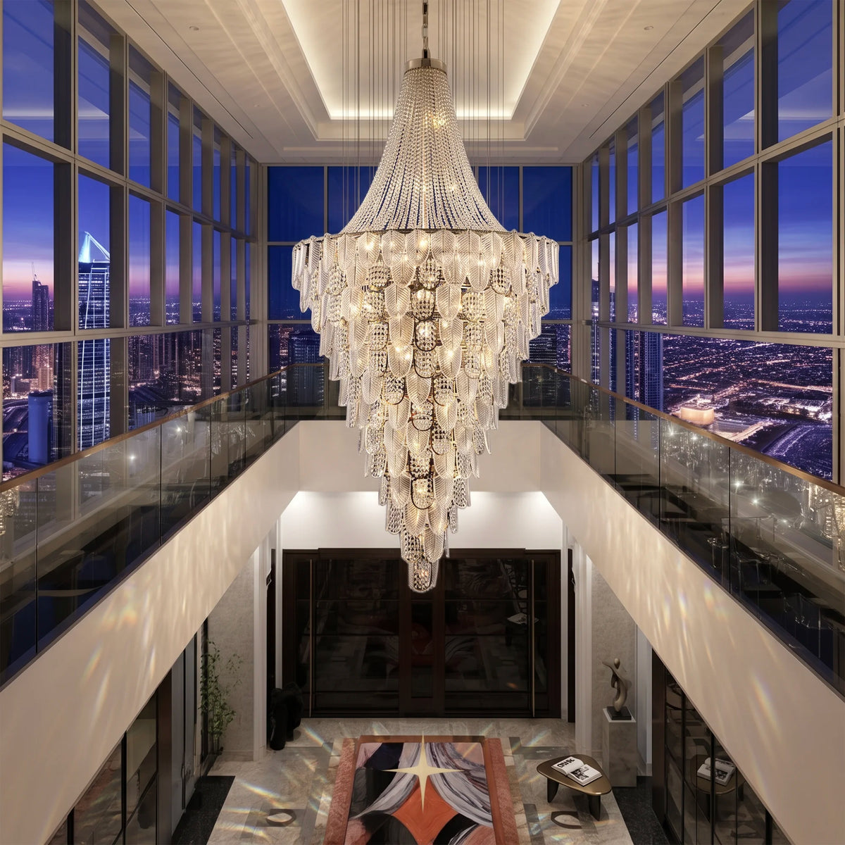 Overhead view of Grand Orlando monumental chandelier suspended in a luxury duplex staircase space