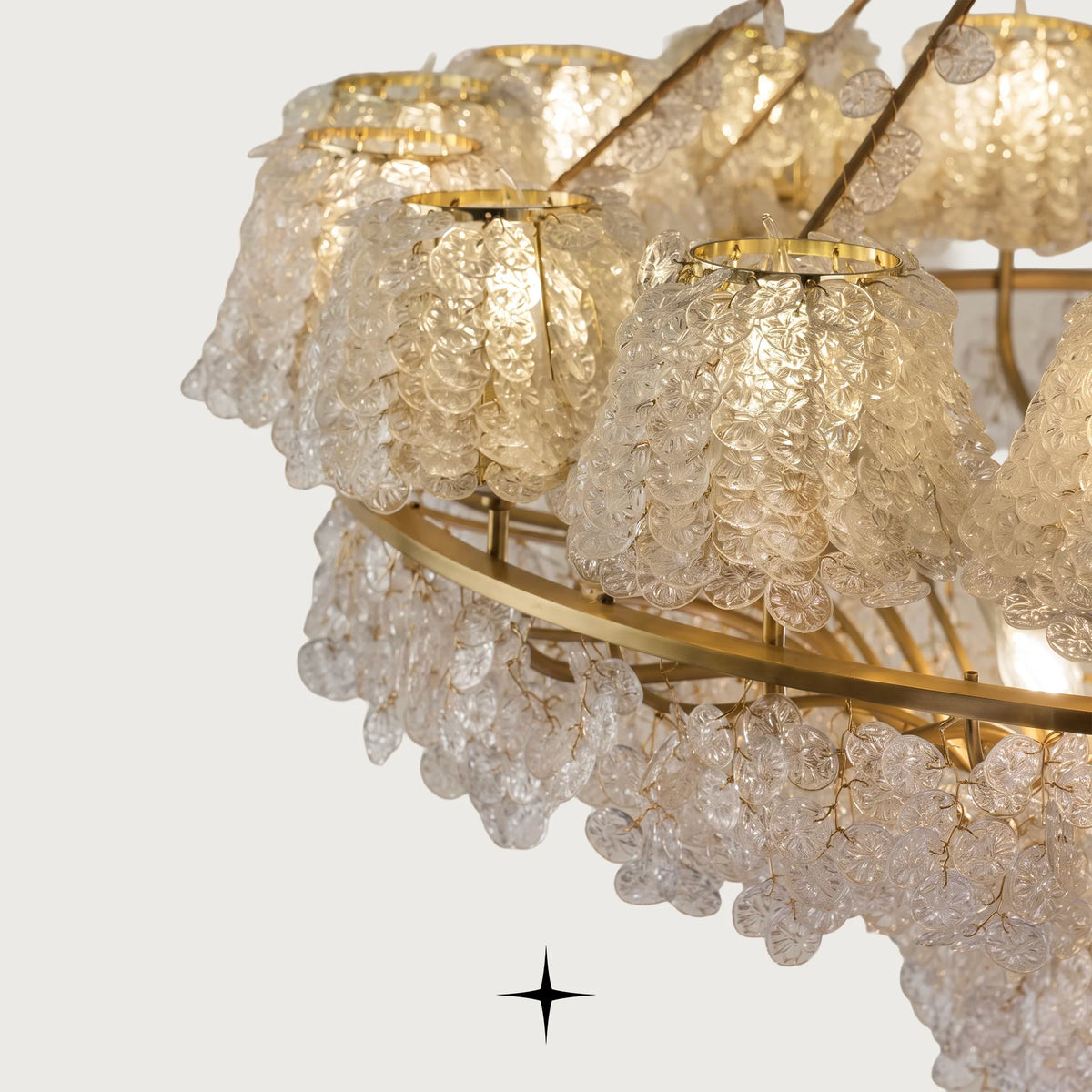  Close-up of layered clear glass teardrop elements on Grand Oslo light fixture