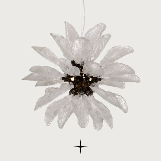 Grand Pristine Murano-style glass leaf chandelier with warm glow on light grey background