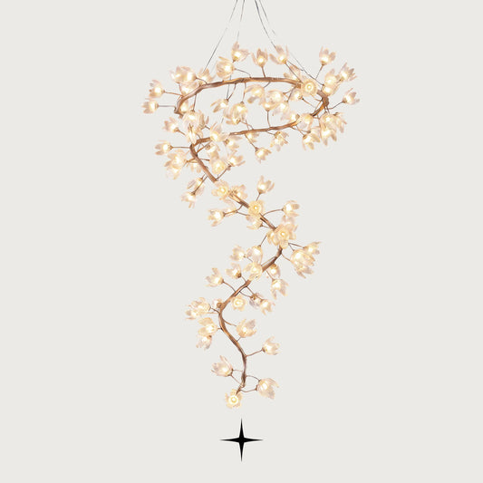 Full view of the Grand Sakura spiral crystal flower chandelier with hand-forged metal branches on a grey background