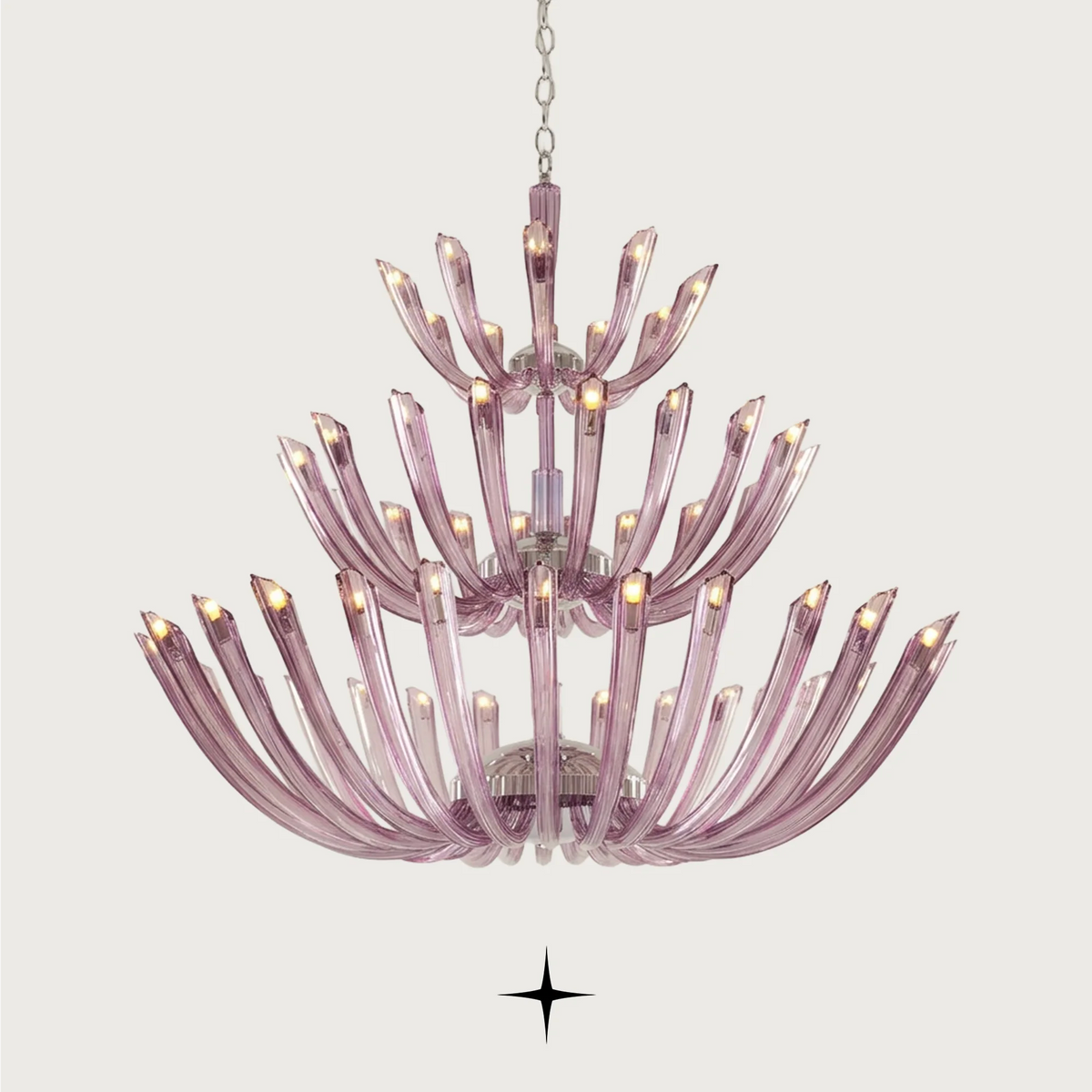 Grand Sienna Chandelier featuring chic elongated crystal arms available in five chandelier sizes and a wall lamp.
