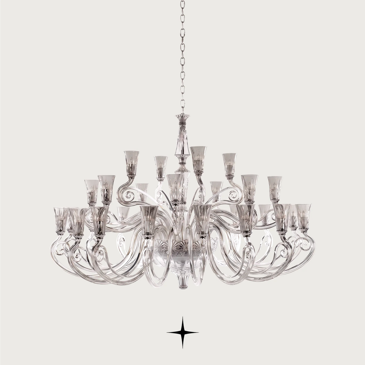 Grand Sophia Chandelier featuring chic elongated crystal arms available in five chandelier sizes and a wall fixture.
