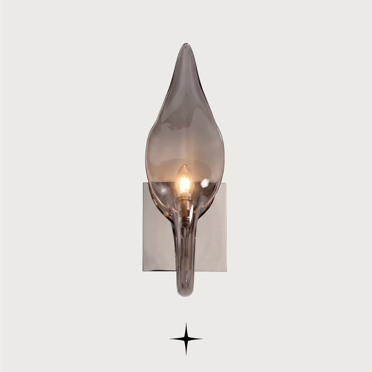 Juliana luxury crystal wall sconce featuring a chic, elongated, and curvaceous Bohemian crystal arm in smoky tones.
