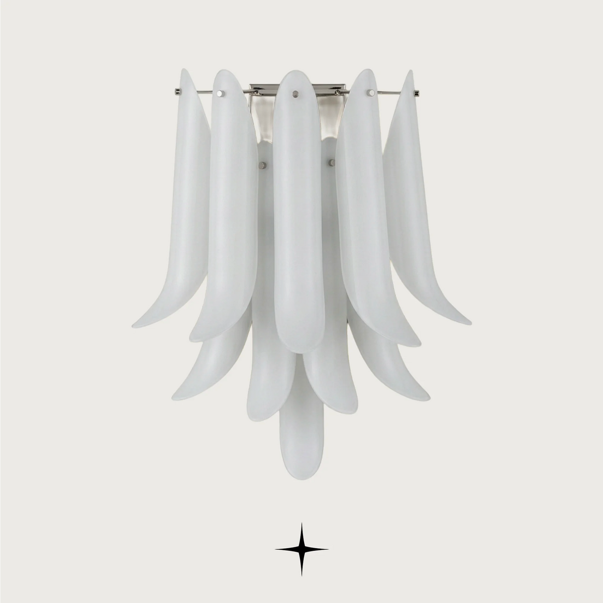 Juliette Wall light fixture featuring handcrafted crystal wings with pure white exteriors and golden interiors.
