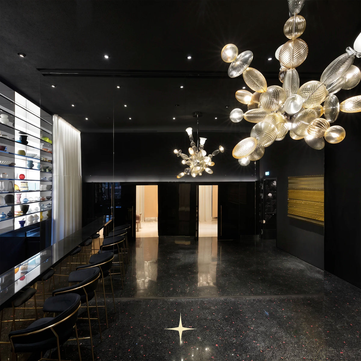 Lambada sculptural glass chandelier in a bright, modern luxury living room