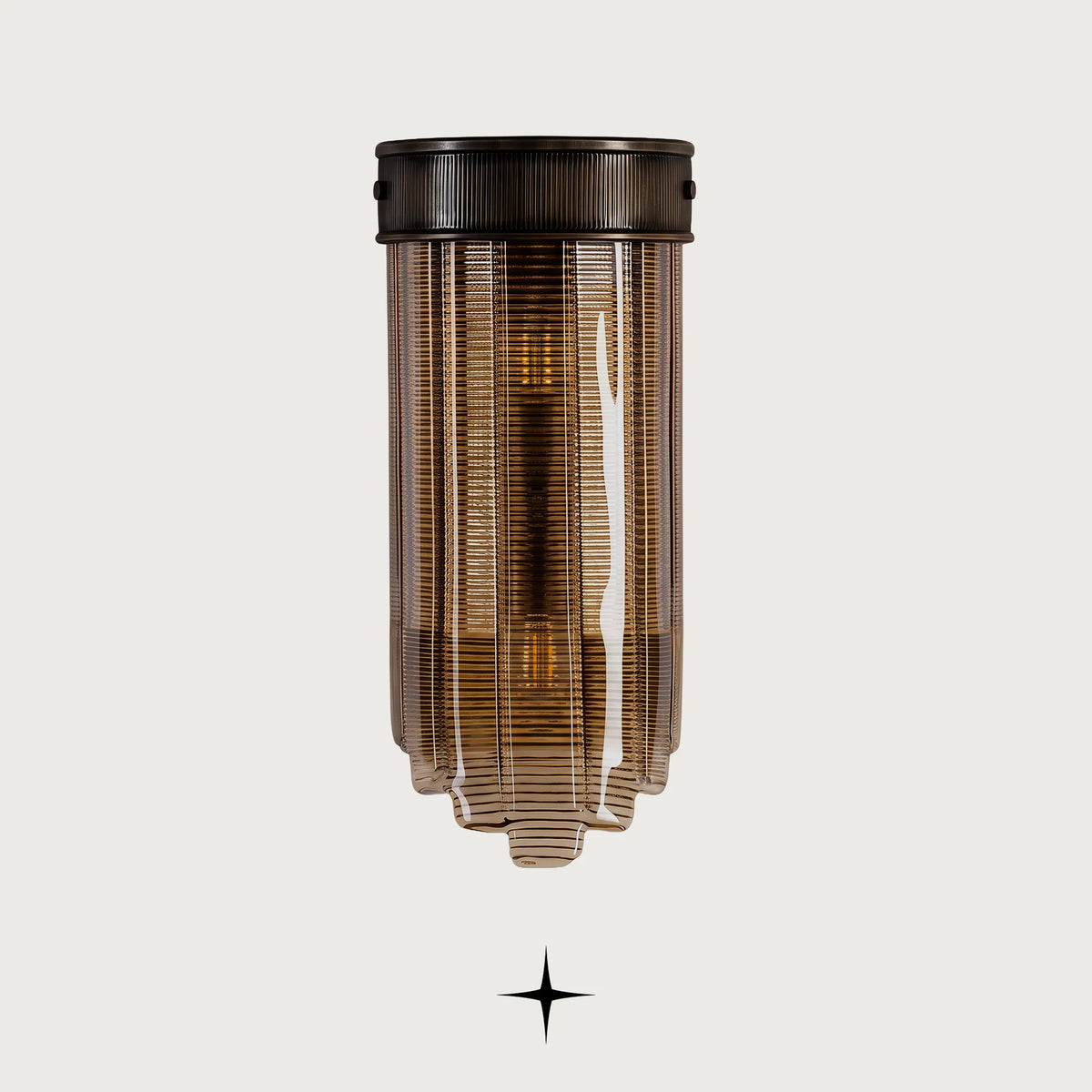 Lantern modern ribbed amber glass wall sconce off a light grey background