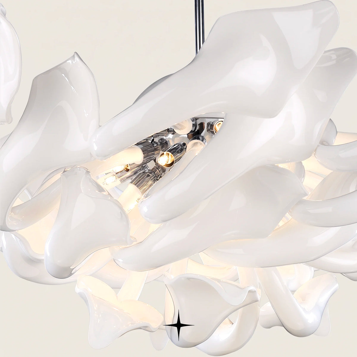 Lavish Naria Chandelier featuring chic elongated white crystal arms in multi-tier configurations
