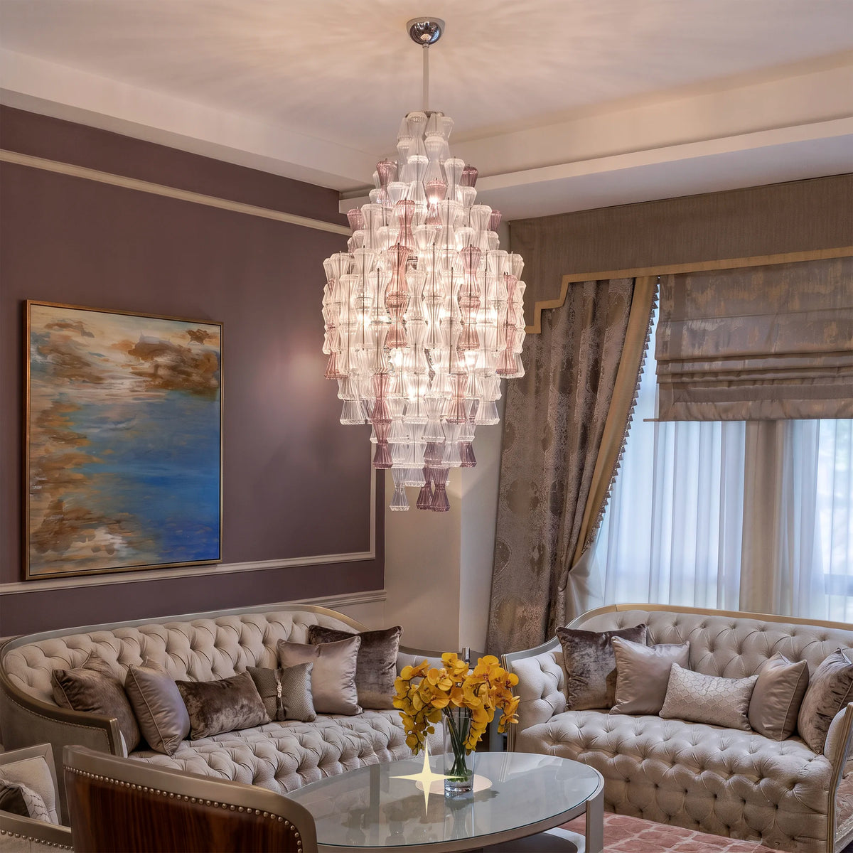 Lavish Seattle luxury chandelier installed in modern high-ceiling living room space
