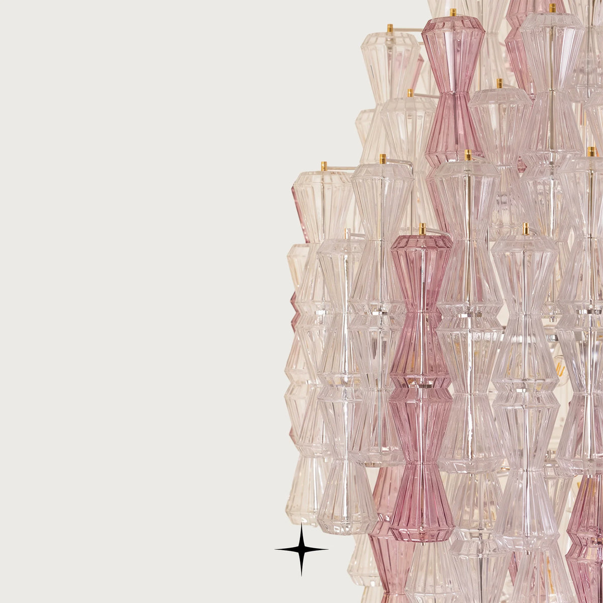 Close-up detail of handcrafted colored Rigadin glass tubes on Lavish Seattle chandelier
