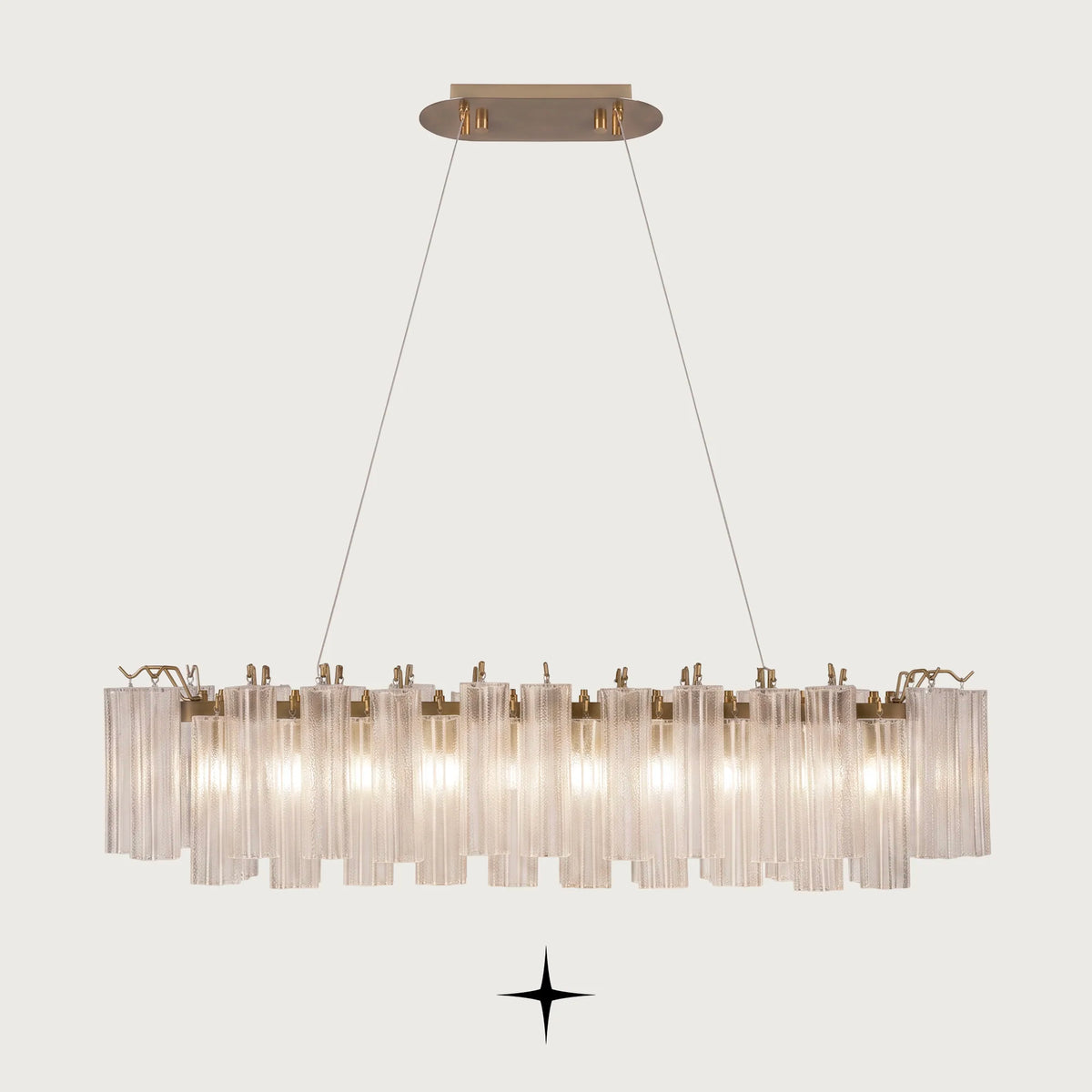 Linear Astra horizontal brass chandelier with fluted ribbed glass tubes on light grey background