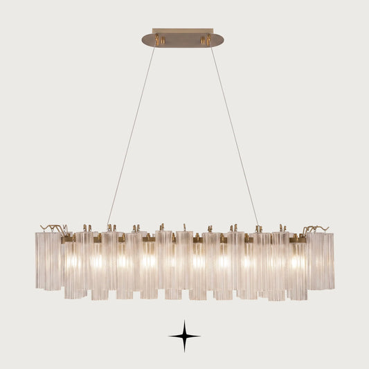 Linear Astra horizontal brass chandelier with fluted ribbed glass tubes on light grey background
