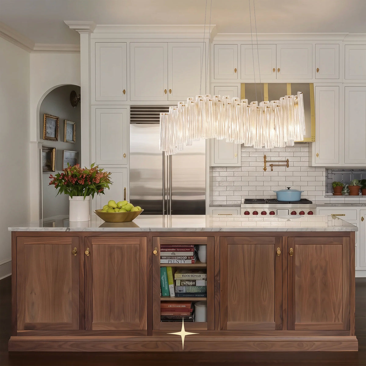 Linear Isabella crystal chandelier installed over a modern kitchen island in an elegant home

