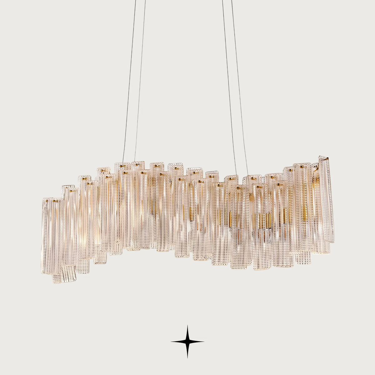 Linear Isabella crystal chandelier with gold frame and layered Murano-style glass bricks
