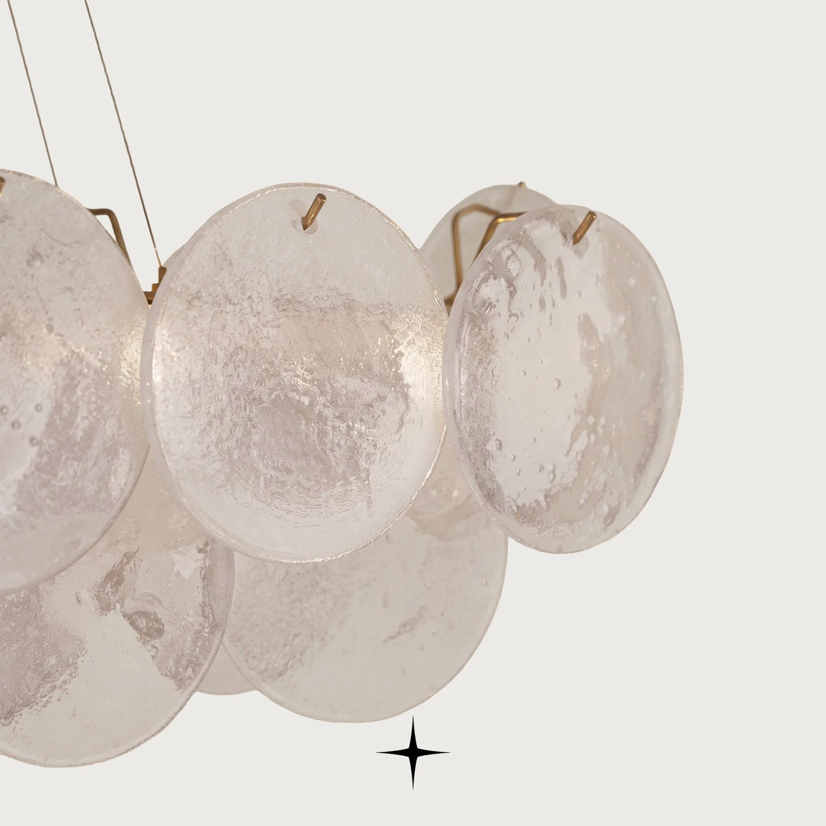 Close-up detail of overlapping illuminated frosted glass discs on Linear Lunaria fixture