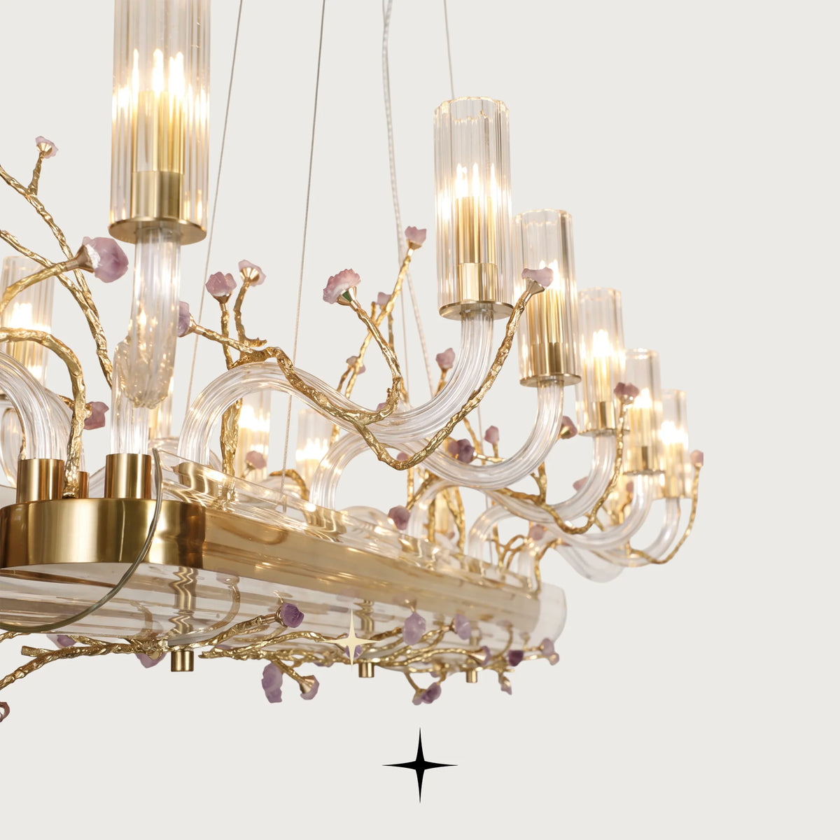 Close-up detail of lustrous brass branches and natural purple rocks on Linear Madison chandelier
