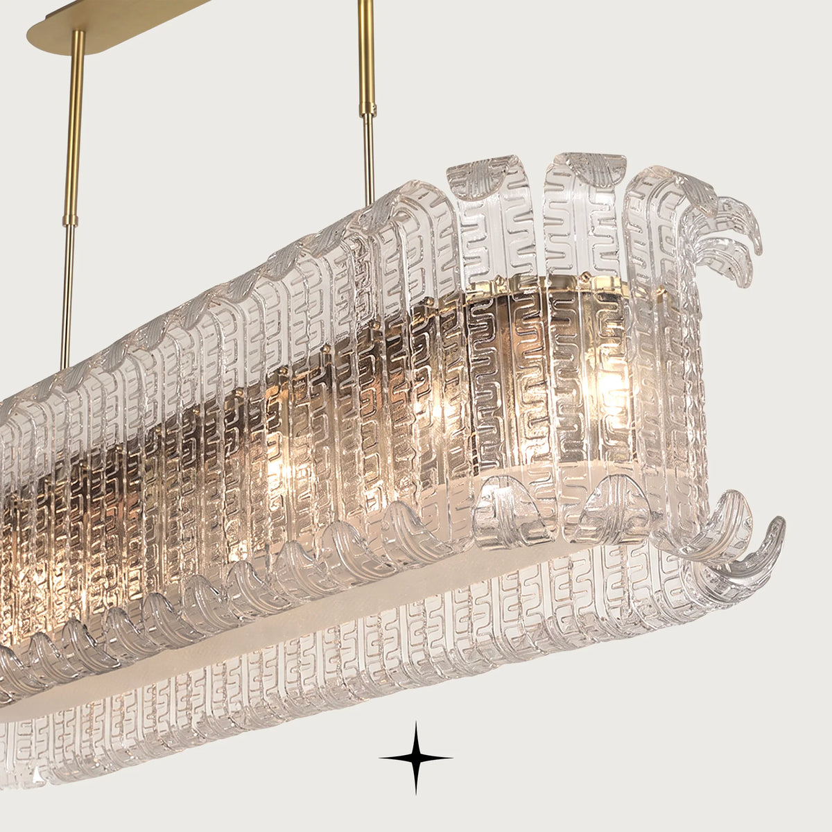 Side angle of Linear Montreal luxury glass chandelier on golden structure
