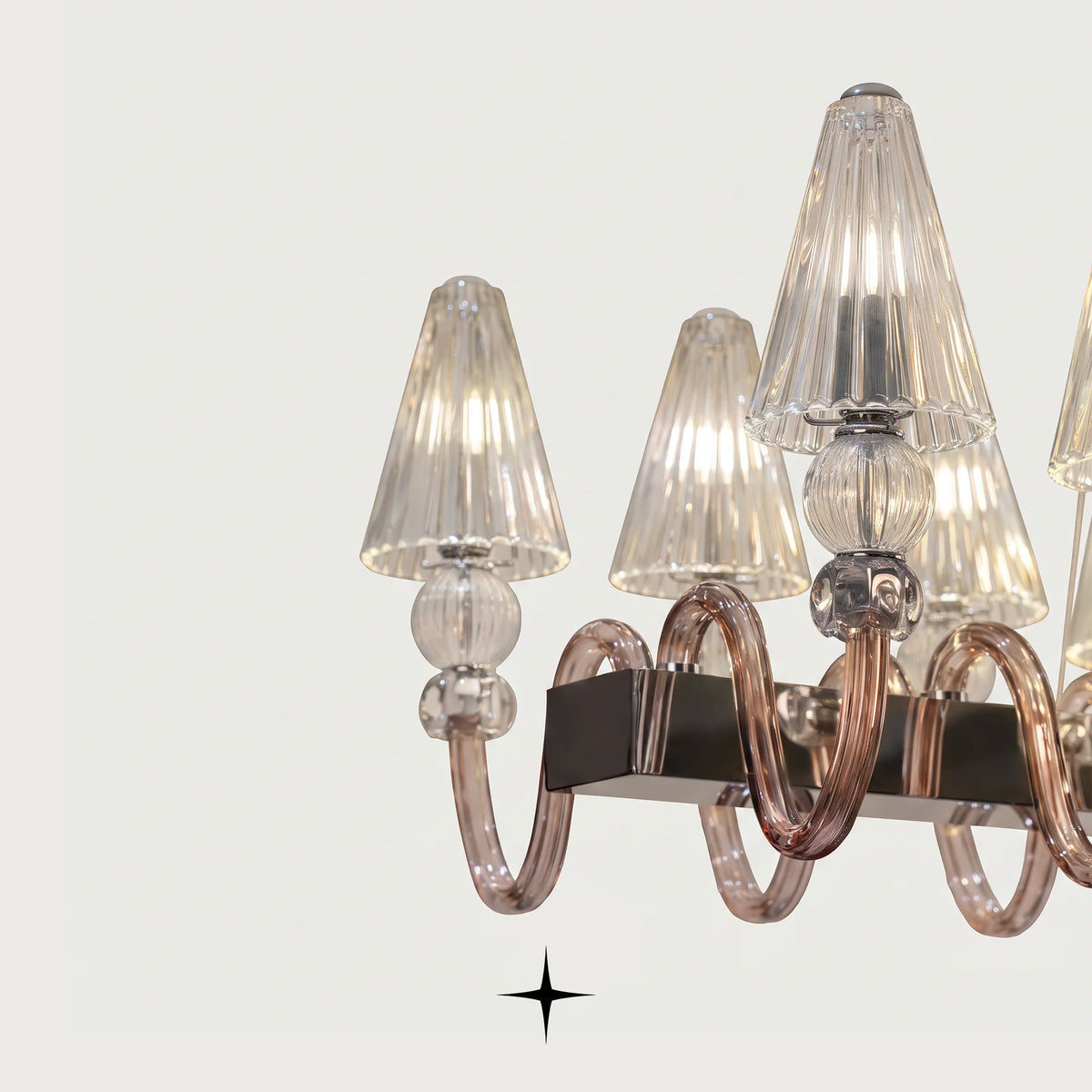 Close-up detail of fluted crystal shades and candle sockets on Linear Muse 