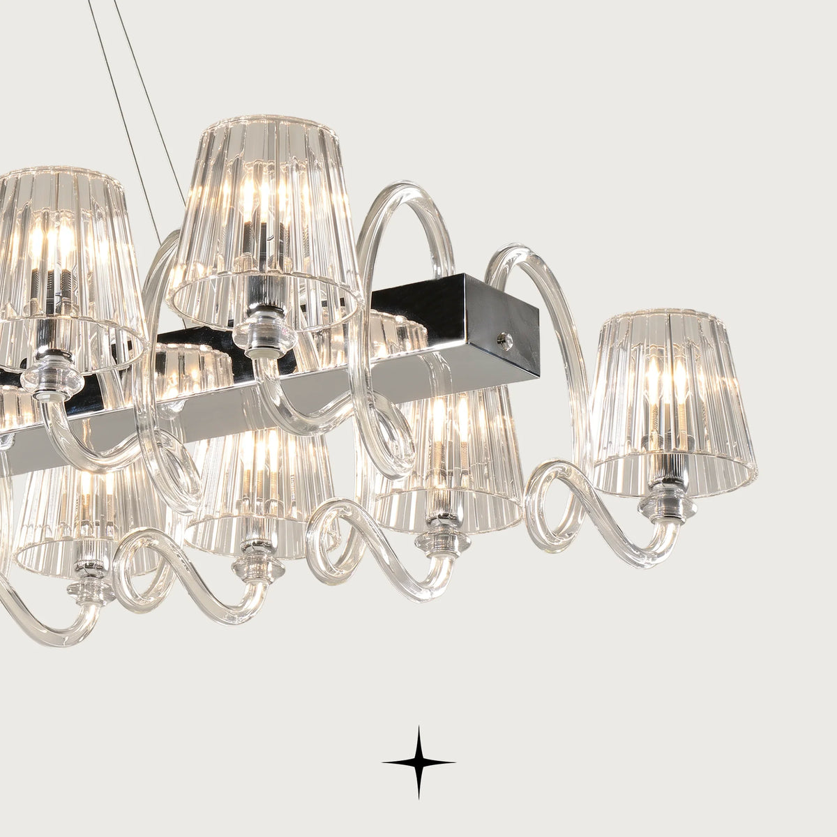 Linear Penelope chandelier featuring chic classic crystal headlamps with a contemporary twist
